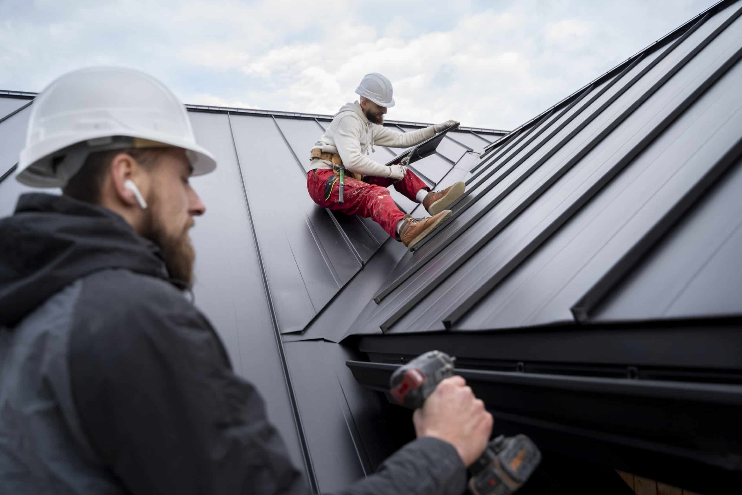 Roofer inspecting a home for signs you need a new roof